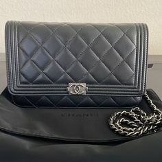 Authentic Chanel Boy Woc In Black Lamb Skin And Gunmetal Hardware. Designed By Karl Lagerfeld. Excellent Condition Inside And Outside. Quilting Is Still Puffy. Tiny Hairline Scratch In The Back But Hardly Noticeable As Seen In Photos. Strap Is Perfect. Comes With Cards, Box And Dust Bag. Please Look At Photos Carefully. Chanel Boy Woc, Lirika Matoshi, Gunmetal Hardware, Chanel Boy, Chanel Bag, Karl Lagerfeld, Black Silver, Dust Bag, Quilting