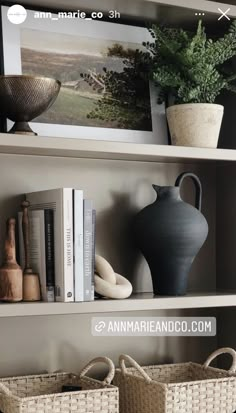 the shelves have baskets and vases on them, along with other decorative items such as books