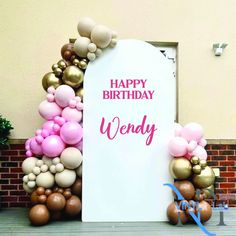 there is a sign that says happy birthday wendy with balloons all over the front and back