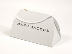 a white paper bag with the word marc jacobs on it's side