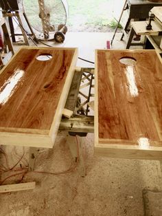 two pieces of wood sitting on top of a table