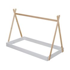 a white shelf with two wooden poles on it