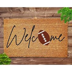 a welcome mat with a football on it