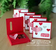 four valentine's day cards in a red box