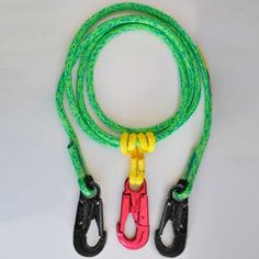 a pair of green and yellow lanyards with hooks