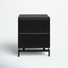 a black cabinet with gold trimmings on the front and bottom, against a white background