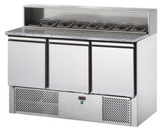 a stainless steel counter with four burners and two doors on one side, in front of a white background