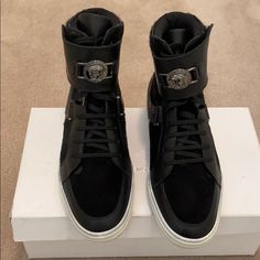 Authentic!!!!! Beautiful Well Kept Versace Sneakers. High Top All Black Wit Silver Medusa Head Across The Strap. Front Suede And The Side Made Of Cow Hide Skin. One Of A Kind, Get Them Before There Gone!! 41.5 Uk... Sneakers High Top, Versace Sneakers, Versace Shoes, Medusa Head, Cow Hide, Mens Shoes Sneakers, High Top, All Black, Black Silver