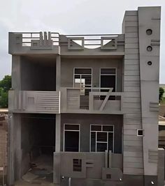 an apartment building with balconies on the second floor