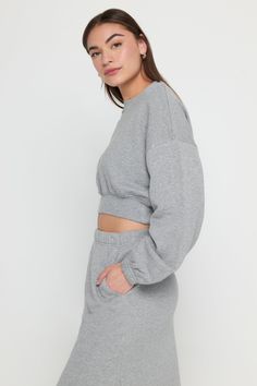 From vinyasa flow to the farmer's market, the softest-ever Aspen Sweatshirt is calling. Balloon sleeves and rib edges elevate an everyday basic, while the Cropped length pairs effortlessly with your favorite high-waisted leggings. The SOAT - Softest Of All Time Layering friendly Leveled-up rib edge detail Hits-perfect Cropped length Relaxed but not baggy (the Goldilocks fit) | Aspen Sweatshirt in Heather Ash Comfortable Fitted Tops For Fall, Comfortable Cozy Fit Sweatshirt For Spring, Spring Ribbed Sweatshirt, Cozy Raglan Sleeve Tops With Ribbed Cuffs, Relaxed Fit Solid Top With Ribbed Waistband, Solid Relaxed Fit Top With Ribbed Waistband, Relaxed Fit Ribbed Athleisure Tops, Relaxed Fit Top With Ribbed Waistband, Cozy Fit Basic Top For Loungewear