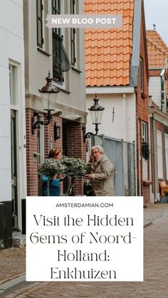 an old woman walking down the street in front of some buildings with text overlay that reads visit the hidden gems of noord holland