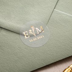 a close up of an envelope with a sticker that says em on the front