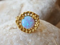 "Mint Opal ring, Aqua blue opal ring, Gold ring, Gemstone ring, Light blue stone ring, October birthstone ring, Bridal ring Vintage style Measurements: Size: 7 US and 8 US-please select in the \"type box\" Diameter: 20 mm (0.8 Inches) FOR THIS RING WITH WHITE OPAL: https://www.etsy.com/il-en/listing/255496711/opal-ring-white-opal-ring-fire-opal-ring?ref=shop_home_active_1 The ring will be packed in a gift box. FOR MY RINGS COLLECTION HERE: https://www.etsy.com/il-en/shop/rebekajewelry?section_id Opal Gemstone Rings With Round Stone, Opal Gemstone Ring With Round Stone, Blue Opal Promise Ring, Handmade Opal Ring With Round Stone For Gift, Handmade Opal Ring With Round Stone As Gift, Handmade Open Opal Ring, Blue Opal Round Ring, Blue Round Opal Ring, Unique Opal Ring With Birthstone