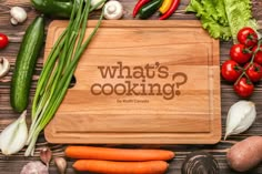 a cutting board with the words who's your favorite? surrounded by fresh vegetables