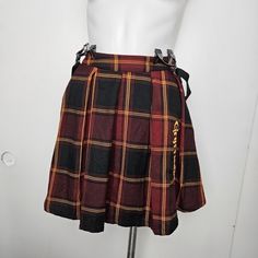 Harry Potter Gryffindor Pleated Suspender Skirt "Gryffindor" Embroidered Along The Side With A Lion. Comes With Removable, Adjustable Suspender Straps, Complete With A Partial Elasticated Waistband And A Side Zipper Closure. 80% Polyester; 18% Rayon; 2% Spandex Wash Cold; Dry Low Slight Stretch Imported Listed In Junior Sizes Pleated School Skirt, School Skirt, Micro Skirt, Harry Potter Gryffindor, Tie Front Cardigan, Suspender Skirt, Plaid Mini Skirt, A Lion, Winter Clothes