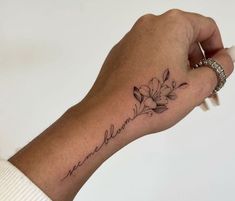 a person's arm with a tattoo on it