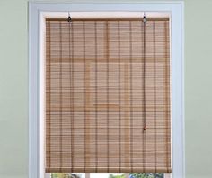 a bamboo blind in front of a window