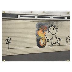 graffiti on the side of a garage door depicting a man holding a fire hydrant