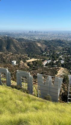 the hollywood sign is on top of a hill