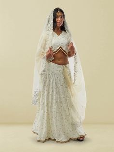 Adorn yourself in elegance with our Ethnochic White Banarasi Georgette Self Embroidered Lehenga with Lace Work. This exquisite lehenga features intricate self-embroidery and delicate lace work on a pristine white Banarasi Georgette fabric, creating a mesmerizing look for any special occasion. The flowing silhouette and detailed craftsmanship make this lehenga a perfect choice for wedding guests or festive events. To care for this garment, we recommend gentle hand washing in cold water to maintai Georgette Lehenga, Embroidered Lehenga, Festive Look, Georgette Fabric, Wedding Guests, Leggings Shop, Large White, Salwar Kameez, Mommy And Me