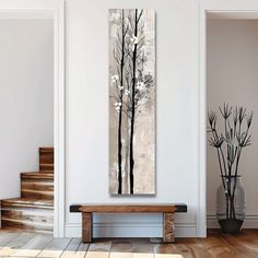 a painting hanging on the wall next to a wooden bench