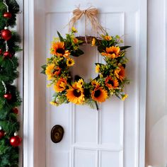 a sunflower wreath hangs on the front door