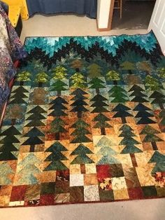 there is a large quilt on the floor