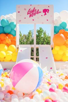 Giant ball pit with double slide and Barbie decals. White, blue, orange, yellow and pink balloon garland. Beach ball inflatables. Scottsdale Arizona Barbie 4th Birthday, Malibu Barbie Birthday Party, Malibu Barbie Party, Barbie Themed Birthday Party, Barbie Pool Party, Barbie Malibu, Barbie Party Decorations, Barbie Sets