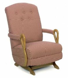 an old fashioned rocking chair with checkered upholstered fabric and wooden legs,