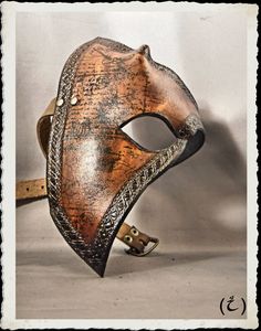 Here is a unique and fully handmade half mask, added to the Tempus collection (other items in this style are available in this shop). This mask is made of 6-7 oz veg tanned leather dyed with warm dark-brown and medium brown, treated with a leather satin acrylic finisher. Handwriting and hand-punched patterns adorn this creation. The leather strap have a buckle made from steel and antique bronze plated. It's long enough to any size of head or top hat, attached to the frame with bronze plated rive Medieval Mask For Larp, Leather Masks And Prosthetics For Halloween Masquerade, Unique Masquerade Mask, Half Mask, Costume Masks, Leather Dye, Veg Tan Leather, Medium Brown, Top Hat