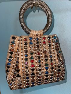 You don't have to be famous to live out your own red-carpet moment! our unique gorgeous handmade bags will help you in this. Emirates, Moroccan and Turk style in a single version. It's not just a bag this piece of art! Almost all bags presented in a single copy. The sparkling golden rhinestones glimmer, and beautiful crystals adds even more sparkle to this bag. With its lined interior, fits just the essentials. Glamorous Handheld Shoulder Bag For Events, Glamorous Multicolor Bags For Formal Occasions, Luxury Handmade Bags, Luxury Embellished Shoulder Bag For Party, Glamorous Handheld Bag For Events, Glamorous Top Handle Evening Bag, Glamorous Embellished Bags For Events, Luxury Handmade Tote Evening Bag, Multicolor Top Handle Shoulder Bag For Party