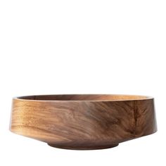 a wooden bowl sitting on top of a white surface