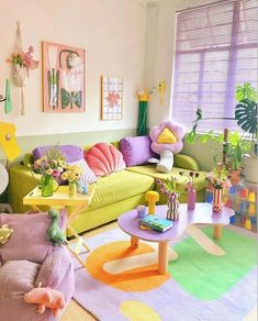 a living room filled with lots of colorful furniture and decor on top of carpeted flooring