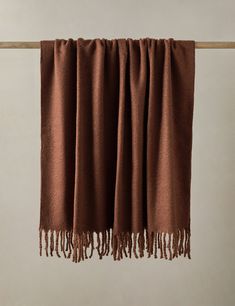 a brown blanket hanging on a clothes line