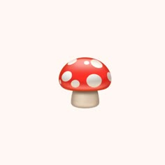 a red mushroom with white dots on it