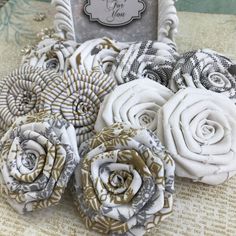 some fabric flowers sitting on top of a table