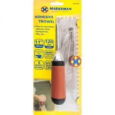 an adhesivee trowel is packaged in a package for use with other tools