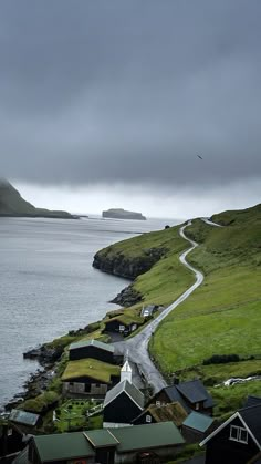 a small village on the side of a body of water