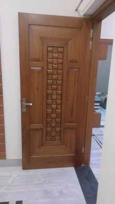 the door is made of wood and has an intricate design