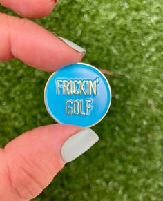 a person holding a blue friskin golf pin in their hand