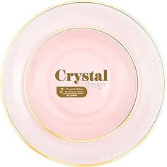 a white and gold plate with the word crystal on it's center, sitting in front of a white background