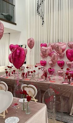 the tables are set up with heart shaped balloons