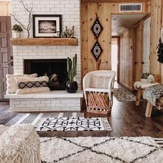 a living room filled with furniture and a fire place