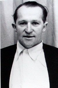 a black and white photo of a man in a suit