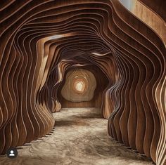 the tunnel is made out of wood and has wavy lines on each side, making it look like they are floating in water