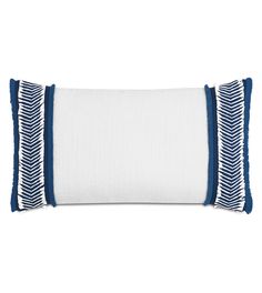 a white and blue pillow with stripes on the bottom, in front of a white background