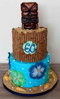 a birthday cake made to look like a tiki with the number 60 on it