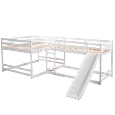 a white bunk bed with a slide next to it