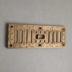 a decorative cast iron grate on the wall