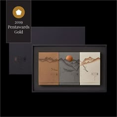 the award is presented in this black and gold presentation case, with three different designs